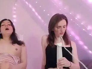 Two Shemales Play with Vibrators on Their Cocks
